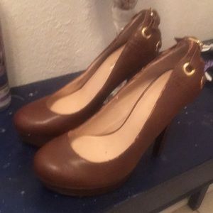 Brown Guess stiletto platform heels.